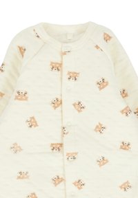 Body neonato color crema con bottoni a pressione, caratterizzato da un motivo di piccoli volti di gatti marroni chiari con baffi.