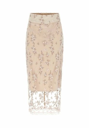 Beiger Midirock mit hoher Taille, floraler Stickerei und einem durchscheinenden Spitzenabschluss, der unter dem Futter hervorragt.