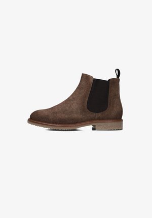 Bottines Chelsea en suede marron avec des panneaux latéraux en élasthanne noir, semelle en caoutchouc lisse et une languette à l'arrière pour un enfilage facile.