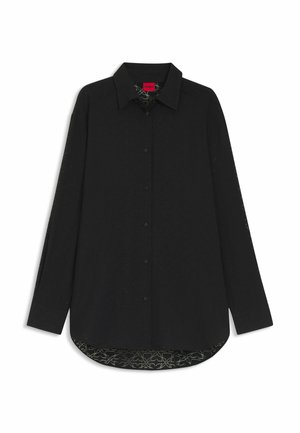 Black long-sleeve shirt with a collar, featuring button closure and a patterned inner lining with abstract designs. Textured fabric.