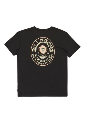 Camiseta de algodón negra con un estampado gráfico circular en beige claro, con un motivo de sol y el texto "BILLABONG BOARDSHORT CO. DESDE 1973."