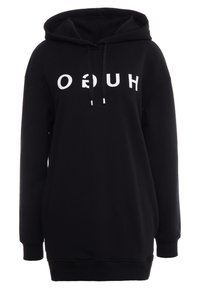 Sweat à capuche noir avec poche kangourou  à l'avant, cordons de serrage et texte blanc "HUGO" sur la poitrine. Coupe ample, matière en coton doux.