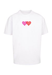 Hvit bomull T-skjorte med et sentralt grafisk motiv av to smilende hjerter, ett rosa og ett rødt, med uttrykksfulle øyne.