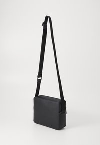 Tommy Hilfiger MONOGRAM MINI MESSENGER - Rankinė per petį - black