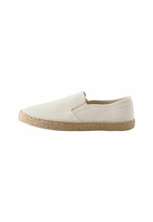 Beige slip-on shoe with woven jute sole and plain fabric upper, side view on white background.