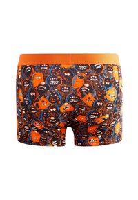 Bóxer para hombre con una cinturilla naranja, tejido negro decorado con caras de monstruos coloridos en patrones de naranja, azul y blanco.