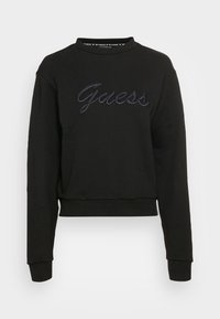 Czarny krótkie bluza dresowa, wykonana z miękkiej tkaniny, z haftowanym logiem "Guess" w ciemnym kolorze, okrągłym dekoltem i długimi rękawami.
