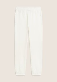 Pantalons de survêtement blancs avec une taille élastique et des poignets, fabriqués en tissu doux. Caractérisés par un petit logo sur le côté, design minimaliste.