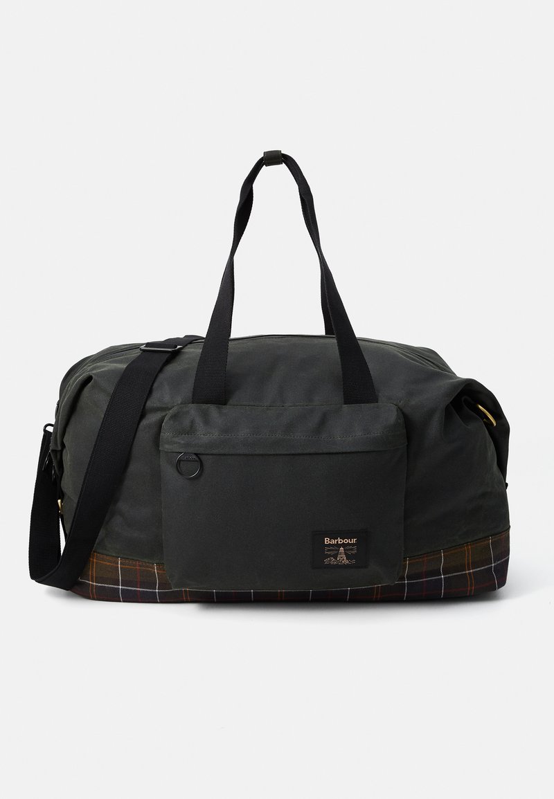 Dark green Barbour duffel bag with black handles, front pocket, adjustable shoulder strap, and tartan-patterned bottom edge.