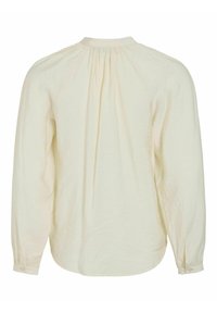 Blouse crème à manches longues avec col haut froncé, coupe ample et poignets boutonnés, vue de dos sur un fond blanc.