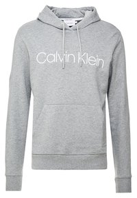 Szara bluza z kapturem, z przednią kieszenią, ściągaczami na rękawach oraz białym logo "Calvin Klein" na piersi.