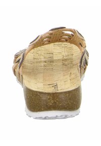 Korksandale mit geflochtenem Lederband, natürlichen Farben, flachem Absatz und strukturiertem Korkfußbett. Gummisohle für Grip und Langlebigkeit.