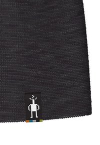 Knit beanie hat in dark gray, featuring a textured surface and a tag with a pixelated figure. Simple and functional design.