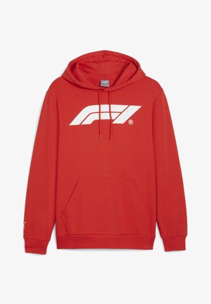 Raudona džemperis su priekine kišene, su stringais reguliuojamu kapišonu ir dideliu baltu "F1" logotipu ant krūtinės. Raišteliniai rankogaliai ir apatinė dalis. Lengvas audinys.