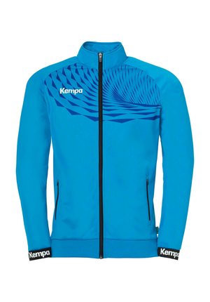 Blauwe sportieve jas van gladde stof met een hoge kraag, volledig met ritssluiting en een grafisch patroon in donkerder blauw op de bovenste voorkant. Bevat merkaccenten.