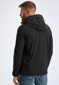 Black jacket with a hood, featuring a smooth texture and detailed stitching. Includes a logo patch on the shoulder and a tailored fit.