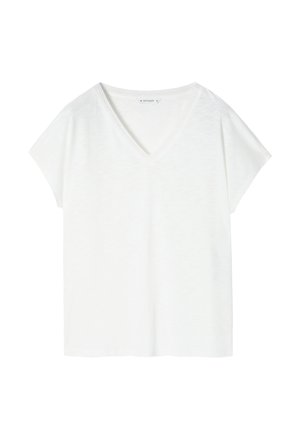 Biała, krótko rękawowa koszulka z dekoltem w kształcie V, wykonana z miękkiego materiału. Charakteryzuje się luźnym krojem oraz prostym, czystym designem bez wzorów lub akcentów.
