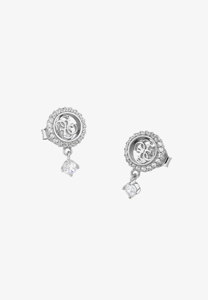 Boucles d'oreilles puces en argent avec des bordures circulaires en cristal, des lettres GS entrelacées à l'intérieur et de petits gemmes clairs pendants.