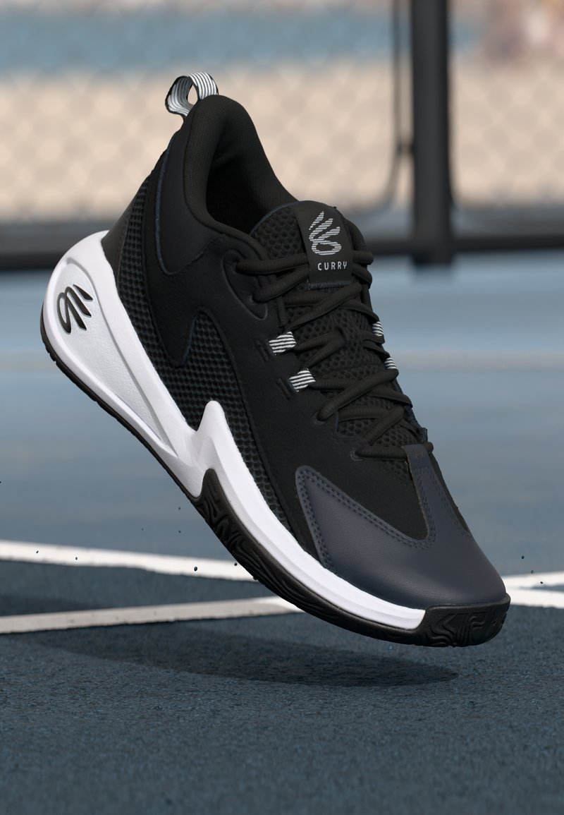 Black athletic shoe with mesh panels, streamlined design, white sole, and grey accents. Features a pull tab and brand logo on tongue.