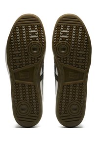 Sneakers Onitsuka Tiger con suole in gomma, dotate di un motivo testurizzato, di colore marrone scuro e con accenti circolari.
