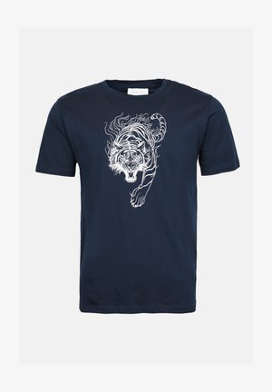 Navy blue T-shirt made of cotton; features a white graphic of a tiger with flowing lines, crew neck, and short sleeves.