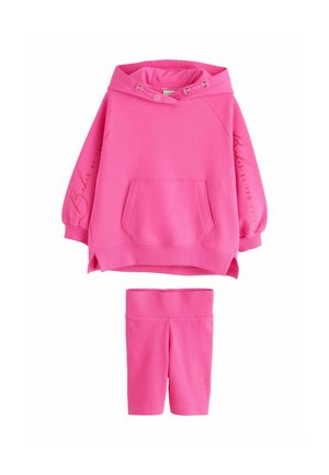 Bright pink hoodie with front pocket and drawstrings, paired with matching knee-length leggings, both featuring subtle branding on sleeves and leg.