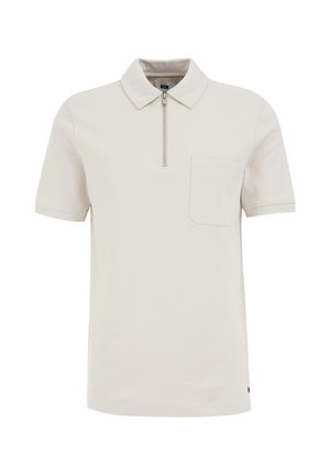 Korte mouwen polo shirt in lichtbeige, met een ritssluiting kraag, een borstzak en strakke stikdetails. Zachte stof textuur.