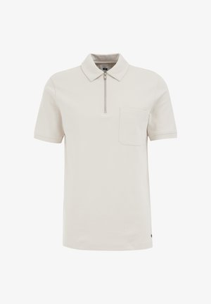 Kortärmad pikétröja i ljusbeige, med dragkedja vid kragen, bröstficka och eleganta sömnadsdetaljer. Mjuk tygtextur.