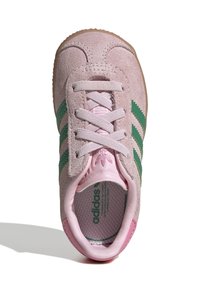 Kids' sneakers in soft pink suede with green stripes. Round toe, lace-up design, padded collar, and a textured rubber sole.