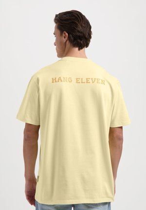 Print T-shirt - pastel yellow