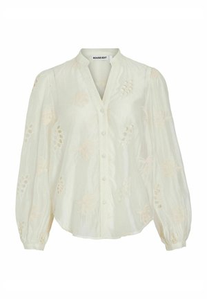 Blouse blanche à manches longues avec une broderie florale subtile, boutonnée sur le devant, et un col montant fin de Rouge Edit.