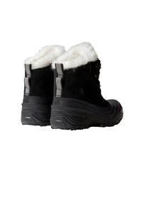 Črni zimsklji škornji iz semiša z belim ovratnikom iz umetnega krzna, hrbtni detajli z vzorcem ribje kosti in teksturiranimi gumijastimi podplati za boljši oprijem.