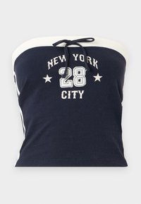 Navy strapless top with white accents, featuring "NEW YORK CITY" and "28" graphics. Material appears soft cotton with a smooth texture.