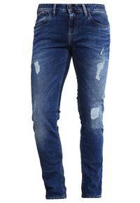 Modré džíny z denimu s úzkým střihem, s odřenými záplatami a vybledlým vzhledem, pět kapsami, mosazným knoflíkem a akcenty v prošívání.