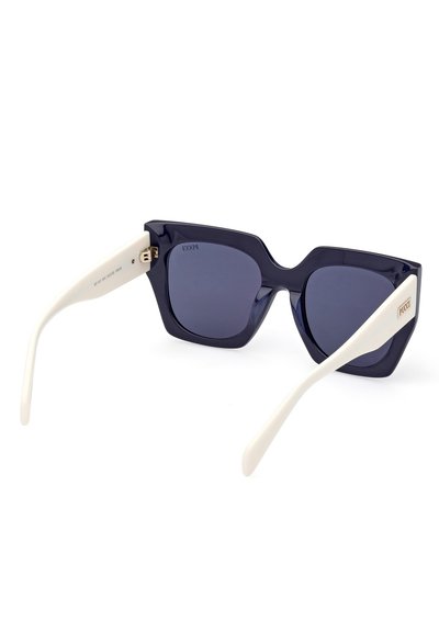 Navy blue sunglasses with a textured, angular frame. White arms with gold logo accents. Dark lenses offer a sleek contrast to the frame.