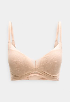 Soutien-gorge en dentelle beige clair avec bretelles fines réglables et armatures, présenté sur un fond blanc uni.
