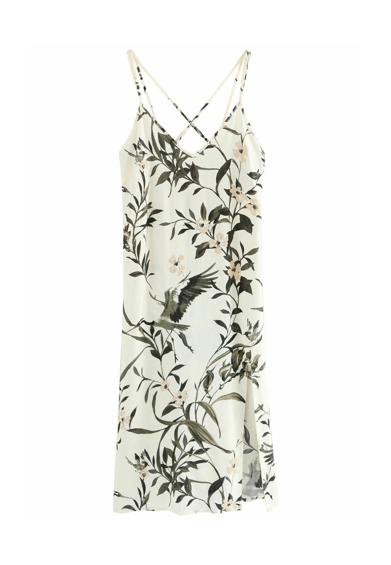 Robe blanche sans manches avec fines bretelles croisées et motif floral et oiseau noir et beige.