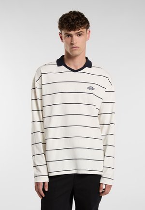 Long-sleeve polo shirt in off-white with navy stripes and a navy collar. Features a small logo on the left chest. Cotton material.