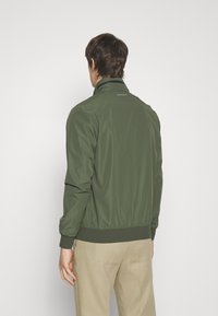 Hackett Aston Martin Racing Giacca a vento - olive