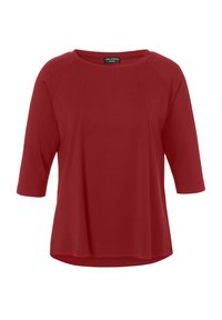 Haut en tissu doux rouge avec un col rond et des manches trois-quarts. Caractéristiques : coutures raglan et ourlet légèrement arrondi pour un ajustement décontracté.
