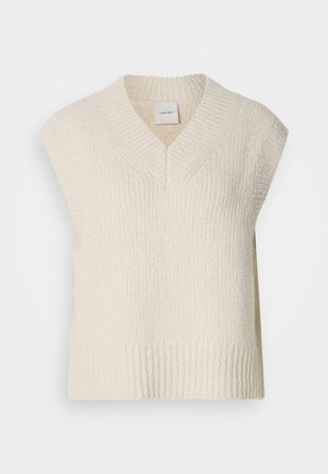 Κρέμα πλεκτό άσπρο γιλέκο χωρίς μανίκια με βαθύ V-λαιμό, ριπ ύφανση στην λαιμόκοψη και το τελείωμα, με ετικέτα στο κέντρο της πλάτης.