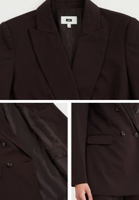 Hnědý dvouřadý blazer z hladkého materiálu. Má špičaté rabaty, boční kapsy a dva knoflíky. Vnitřek je podšitý tmavším materiálem.