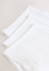White cotton fabric layered, featuring a textured pattern with raised geometric lines and delicate lace trim on the edges.