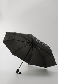 Black umbrella with a curved handle, eight ribs, smooth fabric, and logo detailing on the canopy, offering compact design and durability.