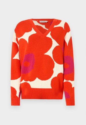 V-neck sweater featuring bold red, white, and purple floral patterns. Made of knitted fabric with ribbed cuffs and hem.