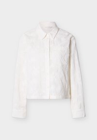 Biela skrátená košeľa na gombíky s dlhými rukávmi, s vyšívaným kvetinovým vzorom a malou náprsnou vreckou. Hladká textura.