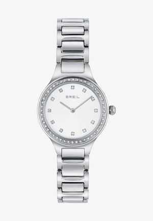 Sølv rustfrit stål armbåndsur med rund urskive, hvid skive, diamanter-lignende markører og en bezel udsmykket med rhinsten.