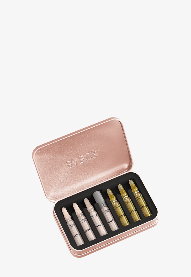 Rose gold metal tin with seven small glass ampoules inside, labeled "BABOR" with two types: Perfect Glow and Multi Vitamin.