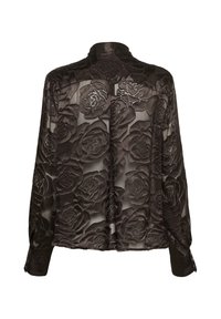 Blusa nera trasparente con motivo a rose in rilievo, maniche lunghe e polsini con bottoni. Presenta un colletto e una vestibilità leggermente sovradimensionata.