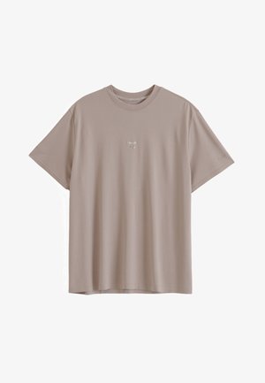 Plain beige short-sleeve t-shirt with crew neck and small white text centered on the chest against a white background.